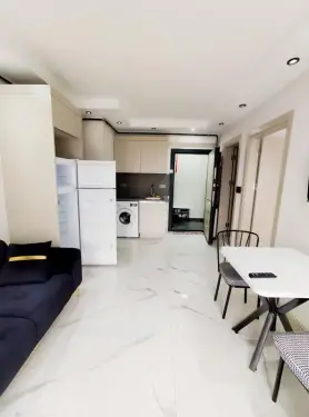 KAMPÜS İÇERİSİNDE 1+1 ARA KAT YERDEN ISITMALI KİRALIK APART